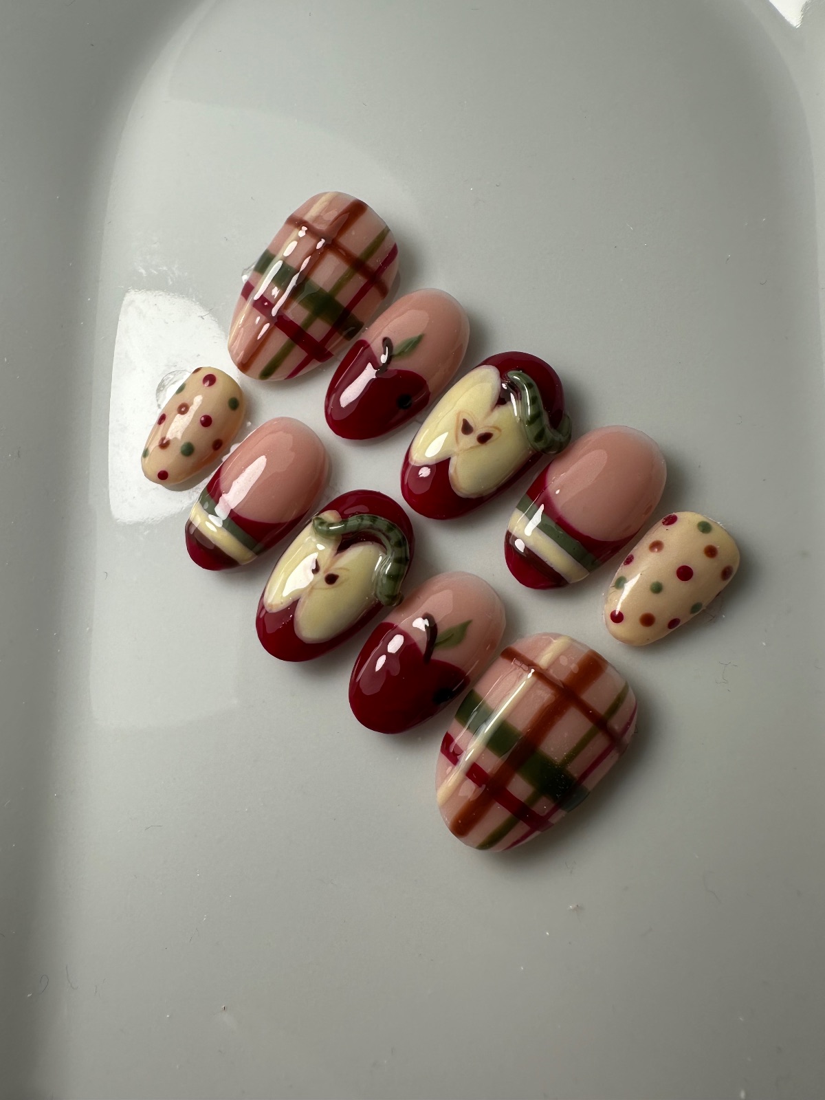 Hand-painted press-on nails in an oval shape, Sweater weather design, photo 3