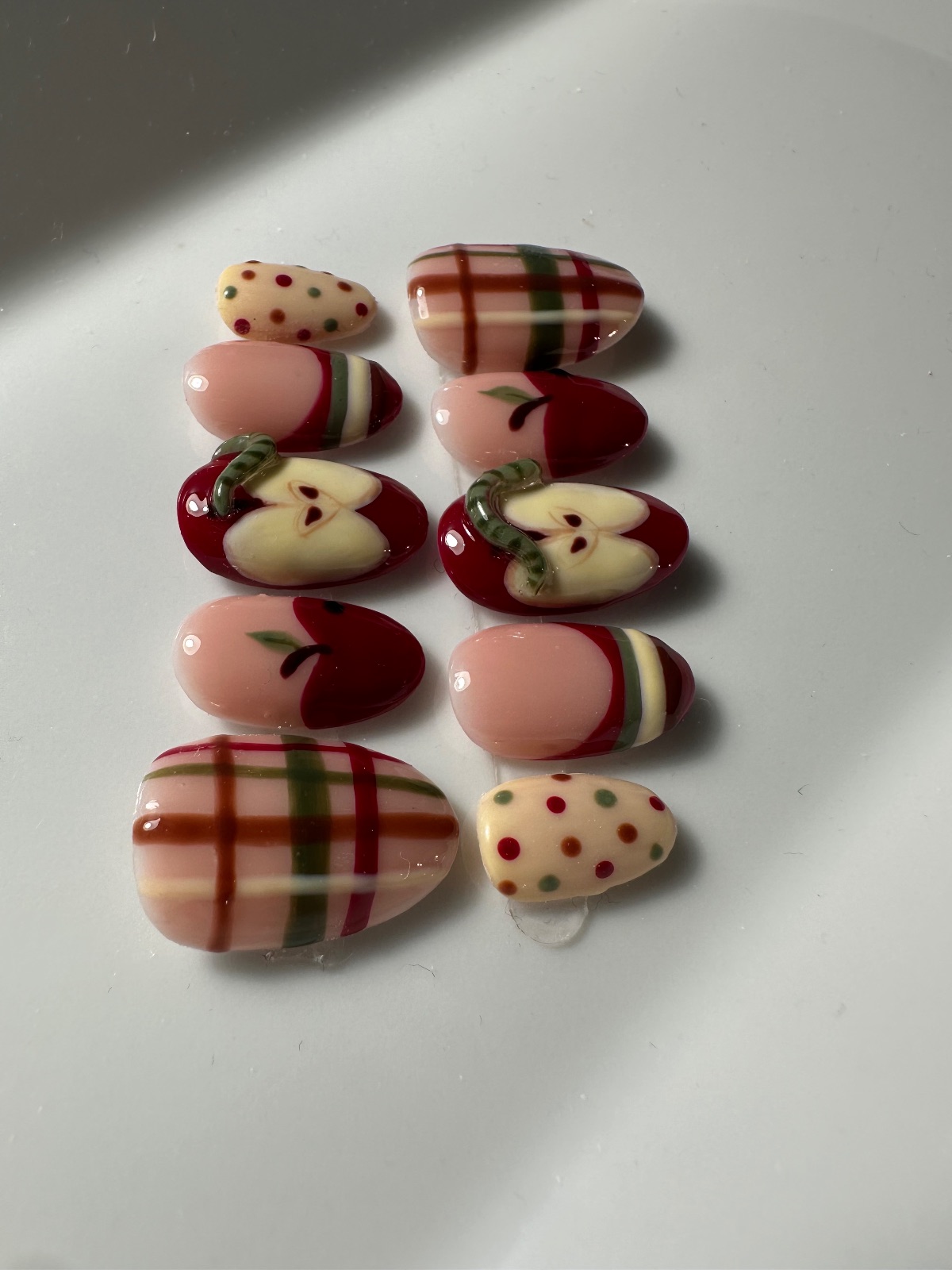Hand-painted press-on nails in an oval shape, Sweater weather design, photo 4