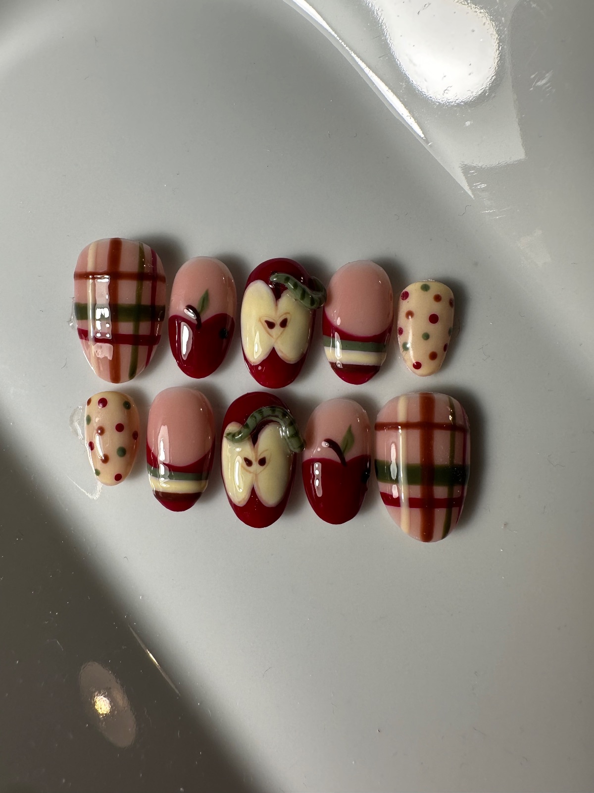 Hand-painted press-on nails in an oval shape, Sweater weather design, photo 5