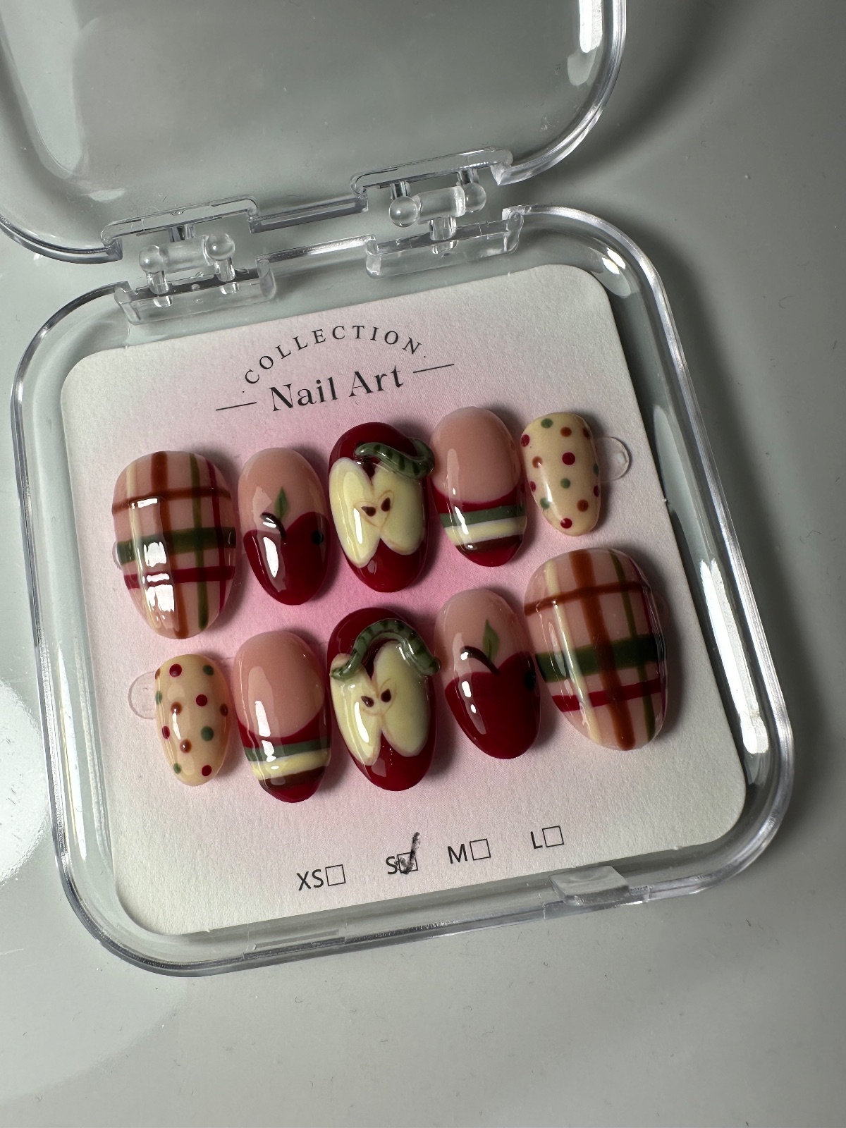 Hand-painted press-on nails in an oval shape, Sweater weather design, photo 6