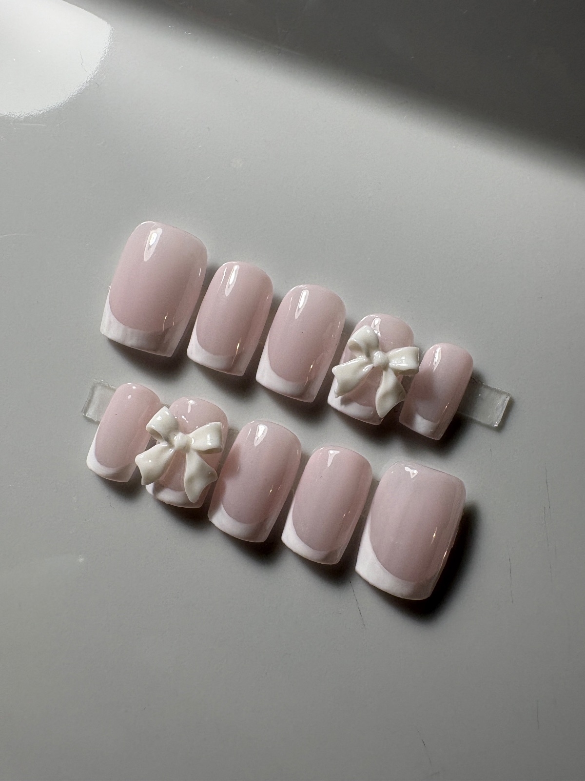 Hand-painted press-on nails in a square shape, Classic white French with a bow design, photo 4