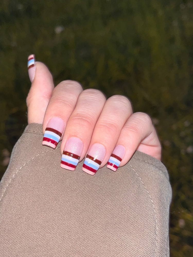 Square nails in horizontal stripes of burgundy, white, blue and pink